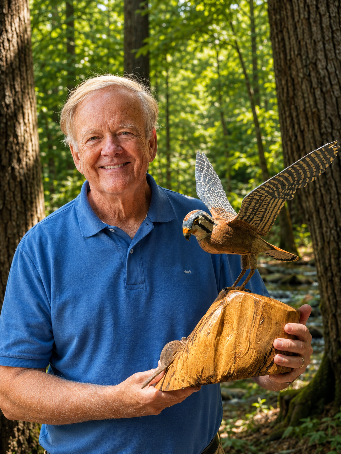Portrait of Sam Meeks holding a carved bird sculpture